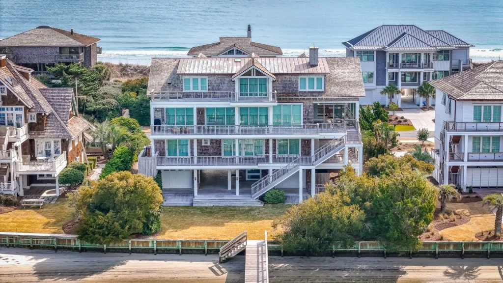 Custom elevated waterfront home built by the Shellhammer Group in Wilmington, NC, featuring impact-resistant windows and coastal design.